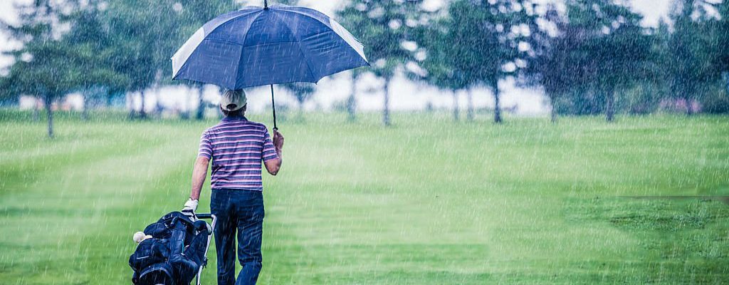 Golfer on a Rainy Day Leaving the Golf Course (the game is annulled because of the storm)